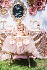 First Birthday Theme Ideas For Girls Once Upon A Time 1st Birthday Party Idea Cute Pink And Gold High Chair Decorati Baby Birthday Party Girl 1st Birthday Party For Girls Baby Girl Birthday Theme