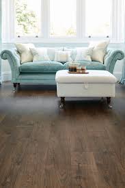 With An Laidback Vintage Look Vantage Wood 12mm Laminate Flooring Everest Oak Comes Wooden Floors Living Room Dark Wood Floors Living Room Luxury Living Room