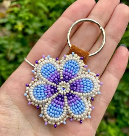 A custom purple floral keychain! For this order, all they specified was  that they wanted something purple, and I think I nailed it 😉 Honestly, I  love it when customers give me