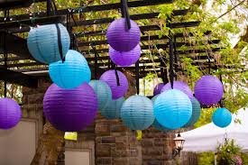 These classic paper lanterns are so easy to make and can be decorated as festive decorations for any occasion or event. Event Masters Decor Chinese Lanterns Hanging From A Pergola Outdoor Party Decorations Wedding Lights Outdoor Wedding Reception