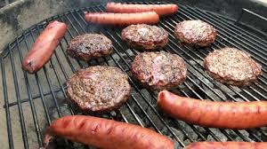 For a charcoal grill, preheat until the charcoal is covered with a white ash. Hamburgers And Hot Dog Grilling Stock Footage Video 100 Royalty Free 4637012 Shutterstock