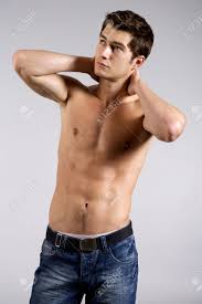 Stylish and confident guy leaning against gray wall with copy space. Cerrar Un Retrato De Jovenes Hombres Guapos Fotos Retratos Imagenes Y Fotografia De Archivo Libres De Derecho Image 22073985