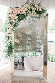 Mirror Wedding Seating Chart Ideas With Floral Decorated
