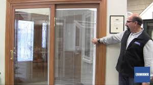 Also called sliding glass doors, these doors are designed to glide horizontally with one operating panel and one stationary panel. Sliding Patio Door With Built In Blinds Youtube