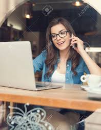 Image result for Happy woman using laptop at café