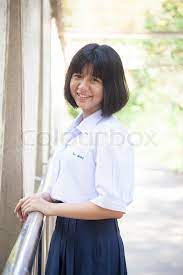 Asian schoolgirl smiling. | Stock image | Colourbox
