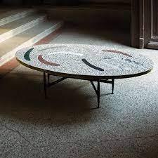 The strong black steel legs are in the classic x formation. Magic Stone Boomerang Coffee Table Kooku