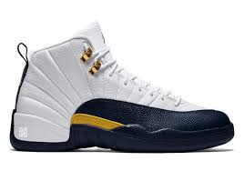 Black And Yellow Jordans 12 Release Date Air Jordan 12 Releasing Again In Michigan Colors Air Jordans Jordans Popular Sneakers