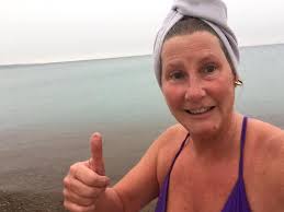 Saturday first timer Chris from Canada. “This is not that cold” “( I love )  swim” “I swim in Lake Ontario