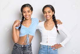 Adorable Black Twin Teen Girl On Studio White Background Stock Photo,  Picture and Royalty Free Image. Image 184950460.