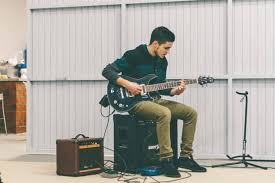 We are sure that at one point in your life, you have simulated holding an imaginary guitar holding your guitar the appropriate way goes a long way in improving how you play. How To Hold An Electric Guitar Properly A Pro S 1 Tips