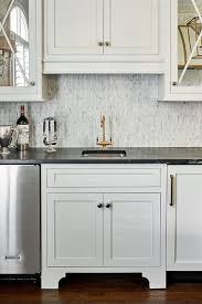 Bianco oro, calacatta vision above: Black Marble Countertops With White Cabinets Transitional Kitchen