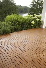This is an example of a farmhouse privacy and full sun front yard stone fence driveway in denver for summer. Outdoor Wooden Patio Flooring Novocom Top