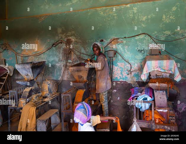 Two women grinding flour in hi-res stock photography and images - Alamy