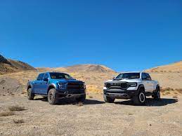 So let's take a look at how this new model stacks up to its predecessor in a comparison: 2021 Ram 1500 Trx Vs 2020 Ford F 150 Raptor A Jurassic Pickup Throwdown