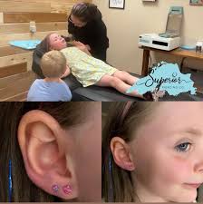 Can someone remove earbuds and open my mom's eye in a photo?