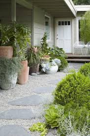 14 Ideas To Make A Small Garden Look Bigger Gardenista Walkway Landscaping Gravel Landscaping Garden Walkway