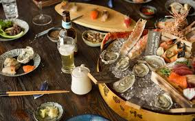 An izakaya (居酒屋) is a type of informal japanese bar that serves alcoholic drinks and snacks. Dragonfly Izakaya Fish Market