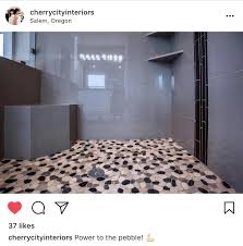We Couldn T Have Said It Better Ourselves Cherry City Interiors Designpower To The River Pebbles Indeed Give Your Shower Style Tile Best Flooring Interior