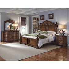 Platinum fabric panels on the headboard and footboard are bejeweled with rhinestone buttons. Pulaski Furniture Cheswick 4 Piece Poster Bedroom Set In Brown