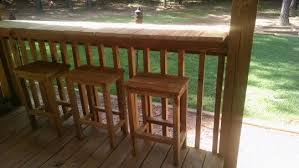 We Made A Bar On Top Of The Deck Railing And Bar Stools From Scrap Deck Wood Wood Deck Wood Deck Railing Deck Railings