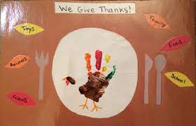 Thanksgiving Placemat We Give Thanks Handprint Turkey And Leaves Fallin Thanksgiving Placemats Preschool Thanksgiving Crafts Preschool Thanksgiving Placemats