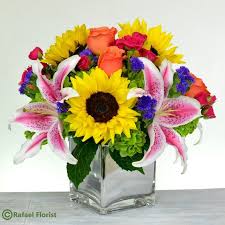 Put your mind at ease, our flowers and plants are always professionally wrapped and delivered by people that care. Sunflowers Orange Roses Stargazer Lilies Magenta Baby Roses And Green Hydrangeas Designed Stargazer Lily Peach Wedding Flowers Flower Centerpieces Wedding