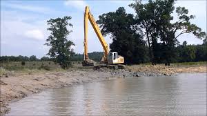 Pond dredging can be a very disruptive process, and if done incorrectly it can cost you a lot more than just money. Liebherr 934 Long Reach Excavator Dredging Pond Youtube