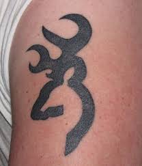 Black and grey ink browning deer tattoo on side rib. Browning Tattoos Beauty Logic Blog
