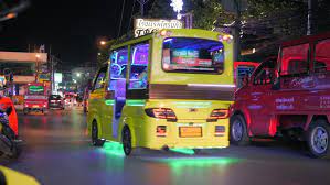 The driver is sitting on the right, and you should approach the cab on the left side for safety. Shutterstock