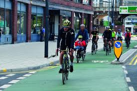 Maybe it is the implausibly youthful face, or the tattered square of dirty, reflective cloth taped to his mudguard. Alistair Brownlee On Leeds Cycle Path Image Eurekalert Science News