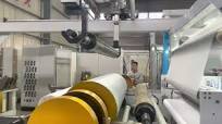 NTH1750 HMA Lamination machine for baby diaper back sheet Nonwoven +PE film  300mpm auto rewind