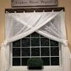 Faux wood blinds are a popular window treatment choice for bathrooms. 3