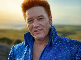 Little Irish boy can't stop his great moves when Elvis' songs are played at  a big do!