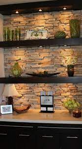 You can see the fireplace is just wood. Floating Shelves With Natural Stone Background Stone Wall Design Stone Wall Interior Design Stone Walls Interior