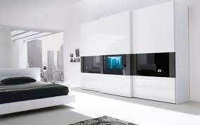 You can use it for displaying television and other decor items. Super Modern Bedroom Wardrobe With A Tv Built In The Door Digsdigs