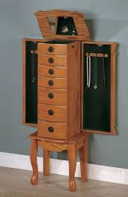 These can accomidate the smallest to largest jewelry collections and has hhok for hanging necklaces and bracelets and drawers for ring and earring storage. Coaster Jewelry Armoire In Oak With Green Felt Lined Drawers 900135 900135 Coaster Furniture