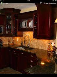 I M Really Liking This Look Dark Cherry Cabinets Uba Tuba Granite Countertops An Antique White Kitchen Antique White Kitchen Cabinets Brown Kitchen Cabinets