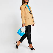 2 button, 2 lower flap pockets and breast welt. Camel Oversized Button Detail Blazer River Island