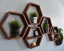 The rustic hexagon shelf set is the ideal way to add geometric intrigue to your overall decor aesthetic. Hexagon Shelves Etsy