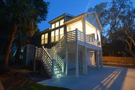 Plans for houses on stilts have a grid system of girders (beams), piers, and footings to elevate the structure of the home above the ground plane or grade. Abalina Beach Cottage Coastal House Plans From Coastal Home Plans