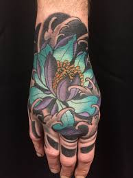 Japanese tattoos not only look incredible but are also imbued with a range of meanings and have a long and complex cultural history and significance. Lotus Hand Tattoo Lotus Hand Tattoo Hand Tattoos Japanese Tattoo