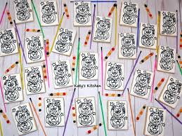 Ice the small cookie as well, let it crust for about 2 or 3 minutes and then place some m&m's for your paint colors. Katy S Kitchen Paint Your Own Halloween Cookies