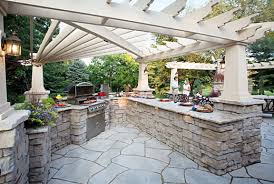 To create a transition from the new pergola to the lounge area, the team designed a path of six bluestone pavers. Outdoor Kitchens