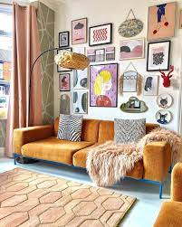 Choosing neutral larger pieces of furniture like the sofa and armchair allows you to have fun with smaller pieces of furniture, lighting, pillows, and art! 12 Reasons To Get On The Ochre Color Trend Eclectic Living Room Eclectic Decor Living Room Art