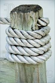 Photo Of Nautical Rope Winding On Wooden Stake For Our Deck Rope Decor Nautical Rope Nautical Landscaping