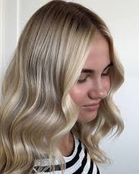 There's a reason the Hailey Bieber bob is everywhere—it's effortless,  timeless, and just the right amount of undone. This cut gives you that  cool-girl texture with all the movement and dimension, whether