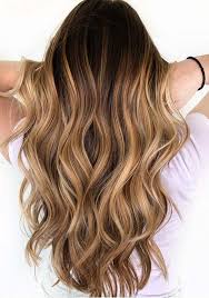 Medium length haircut with a lot of layers perfectly goes for round faces. Caramel Hair Color Ideas Thelatestfashiontrends Com