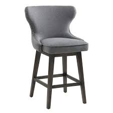 Stylish bar stools provide a sense of authenticity and comfort to your home bar or kitchen counter experience. A Transitional Swivel Stool With Elegant Contours And A Button Tufted Back With Antique Gold Nail Head Stre Bar Stools Swivel Counter Stools Swivel Barstools