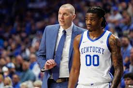 Mark Pope and Otega Oweh take a moment for themselves after he hit the  game-winner to give Kentucky the win over Oklahoma.